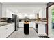 Well-lit kitchen with white cabinetry, stainless steel appliances, and granite countertops at 4570 Moccosin Pl, Greenwood, IN 46142