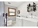 This laundry room features white appliances, a subway tile wall, and a wood trimmed window at 4570 Moccosin Pl, Greenwood, IN 46142