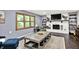 Inviting living room with a large window and a cozy fireplace at 4570 Moccosin Pl, Greenwood, IN 46142