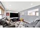 Comfortable living room boasts hardwood floors, a plush sofa, and a large flat-screen TV at 4570 Moccosin Pl, Greenwood, IN 46142