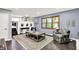 Open-concept living room featuring hardwood floors and lots of natural light at 4570 Moccosin Pl, Greenwood, IN 46142