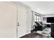 Modern living room featuring a door to the outside, hardwood floors and natural light at 4570 Moccosin Pl, Greenwood, IN 46142