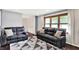 Bright and airy living room featuring comfortable seating and large windows at 4570 Moccosin Pl, Greenwood, IN 46142