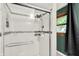 Tiled shower with glass door, and window with wood trim at 4570 Moccosin Pl, Greenwood, IN 46142