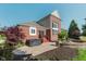 Lovely backyard featuring a brick house with hot tub and outdoor brick fire pit with stone patio at 4617 S Cobblestone Dr, Zionsville, IN 46077