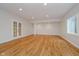 Bright and spacious basement with wood floors and recessed lights, complemented by stylish french doors at 4617 S Cobblestone Dr, Zionsville, IN 46077