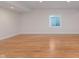 Wood floor basement area with recessed lighting and a basement window at 4617 S Cobblestone Dr, Zionsville, IN 46077