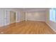Finished basement area with hardwood floors, column, and window at 4617 S Cobblestone Dr, Zionsville, IN 46077