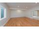 Basement with wood floor, recessed lights and natural light, offering a versatile space for various activities at 4617 S Cobblestone Dr, Zionsville, IN 46077