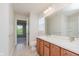 Bathroom with a double sink vanity, large mirror, tile floors, and natural light at 4617 S Cobblestone Dr, Zionsville, IN 46077