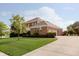 Well-maintained home exterior featuring a lush lawn and extended driveway at 4617 S Cobblestone Dr, Zionsville, IN 46077