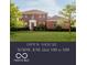 Charming red brick home featuring a well-manicured lawn and mature trees with an open house banner displayed at 4617 S Cobblestone Dr, Zionsville, IN 46077