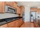 Gourmet kitchen with stainless steel appliances, gas range, and granite countertops at 4617 S Cobblestone Dr, Zionsville, IN 46077