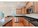 Kitchen features granite countertops, stainless steel appliances, and wooden cabinets at 4617 S Cobblestone Dr, Zionsville, IN 46077