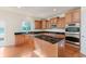 Well-equipped kitchen with granite countertops, stainless steel appliances, and wooden cabinetry at 4617 S Cobblestone Dr, Zionsville, IN 46077
