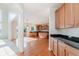 Open kitchen featuring wood cabinets, granite countertops and stainless appliances at 4617 S Cobblestone Dr, Zionsville, IN 46077