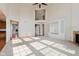 Spacious living room with built-in shelving, fireplace, and tall ceilings at 4617 S Cobblestone Dr, Zionsville, IN 46077