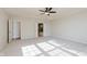 Spacious main bedroom with a ceiling fan and an ensuite bathroom at 4617 S Cobblestone Dr, Zionsville, IN 46077