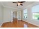 Well-lit office space with hardwood floors, double doors, and a view of the outdoors at 4617 S Cobblestone Dr, Zionsville, IN 46077
