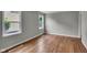 Bright bedroom with hardwood floors and large windows, offering plenty of natural light at 4708 Haverford Ave, Indianapolis, IN 46205