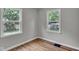 This bedroom is spacious, with light gray walls and hardwood floors at 4708 Haverford Ave, Indianapolis, IN 46205