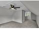 Bonus room featuring vaulted ceilings, new carpet, and a ceiling fan at 4708 Haverford Ave, Indianapolis, IN 46205