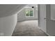 Bonus room featuring vaulted ceilings, new carpet, and a ceiling fan at 4708 Haverford Ave, Indianapolis, IN 46205