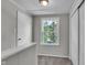Upstairs hallway with new carpet, neutral paint, and a window at 4708 Haverford Ave, Indianapolis, IN 46205