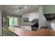 Bright kitchen features white cabinets, subway tile backsplash, and stainless steel appliances at 4708 Haverford Ave, Indianapolis, IN 46205