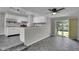 Open concept kitchen with stainless steel appliances and a breakfast bar, connecting to the dining area at 4708 Haverford Ave, Indianapolis, IN 46205
