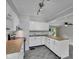 Modern kitchen with white cabinets, stainless steel appliances, and butcher block countertops at 4708 Haverford Ave, Indianapolis, IN 46205