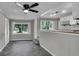 Open concept kitchen with stainless steel appliances and a breakfast bar, connecting to the dining area at 4708 Haverford Ave, Indianapolis, IN 46205
