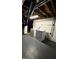 Functional laundry area with white washer and dryer, and painted brick walls at 4708 Haverford Ave, Indianapolis, IN 46205