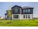 Well-manicured two-story home with large windows and a spacious front yard at 4882 Morning Valley Ct, McCordsville, IN 46055