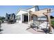 Backyard features a patio, hammock swing, dining area, and manicured landscaping at 4992 Fennel Dr, Pittsboro, IN 46167