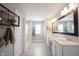 Bright bathroom with double sink vanity, sleek fixtures, and walk-in shower, exuding modern elegance at 4992 Fennel Dr, Pittsboro, IN 46167