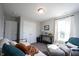 Cozy bedroom featuring ample natural light, comfortable seating, and double-door closet at 4992 Fennel Dr, Pittsboro, IN 46167
