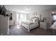 Bright bedroom featuring elegant decor, plush carpet, and abundant natural light, creating a serene retreat at 4992 Fennel Dr, Pittsboro, IN 46167