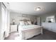 Bright bedroom featuring elegant furnishings, plush carpet, and natural light, creating a peaceful atmosphere at 4992 Fennel Dr, Pittsboro, IN 46167