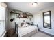 Inviting bedroom with carpet, wall shelving, natural light, and cozy decor around the bed at 4992 Fennel Dr, Pittsboro, IN 46167