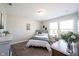 Well-lit bedroom with neutral walls, plush carpet, and a comfortable bed next to two windows at 4992 Fennel Dr, Pittsboro, IN 46167