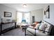 Charming bedroom featuring a daybed, accent chair, natural light, creating a cozy and inviting space at 4992 Fennel Dr, Pittsboro, IN 46167