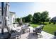 Outdoor deck features plush seating, tables, and umbrella with backyard views at 4992 Fennel Dr, Pittsboro, IN 46167