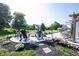 Backyard features fire pit with Adirondack chairs and a cozy hammock swing at 4992 Fennel Dr, Pittsboro, IN 46167