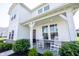 Charming front porch with rocking chairs and elegant white columns at 4992 Fennel Dr, Pittsboro, IN 46167
