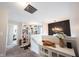 Upstairs hallway with custom shelving and modern chandelier above the stairs at 4992 Fennel Dr, Pittsboro, IN 46167