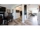 Open hallway with wood floors and stylish decor that connects to the living area at 4992 Fennel Dr, Pittsboro, IN 46167