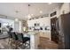 Modern kitchen island with pendant lighting, granite counters, and stainless steel appliances at 4992 Fennel Dr, Pittsboro, IN 46167
