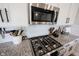 Modern kitchen featuring granite countertops, stainless steel appliances, and white subway tile backsplash at 4992 Fennel Dr, Pittsboro, IN 46167