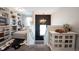 Bright landing area featuring a built-in bookcase, stylish decor, and access to additional living spaces at 4992 Fennel Dr, Pittsboro, IN 46167